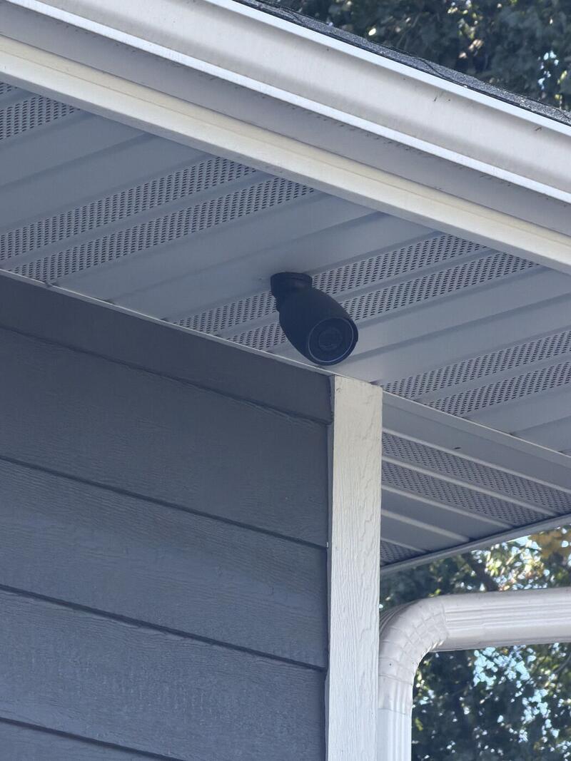 UniFi bullet camera under a home’s eave